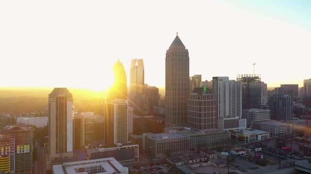 Drone shot of the Atlanta, Georgia skyline during a beautiful sunrise over the city