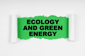 In the middle of the white sheet, the paper is torn, inside on a green background the inscription - Ecology And Green Energy