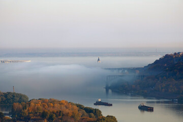 Autumn landscape. Autumn fog over the river. Nizhny Novgorod Oka river.