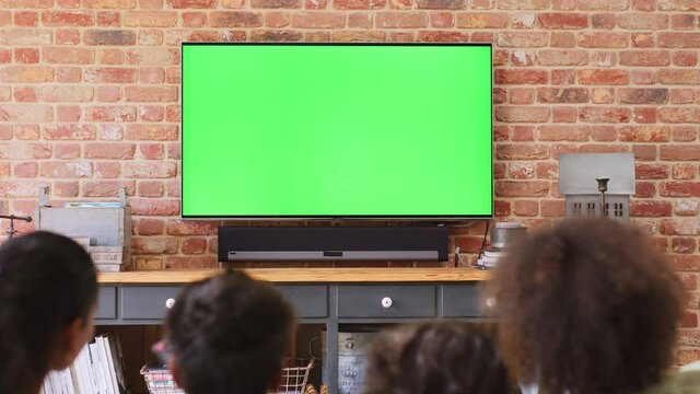 Slow motions of family watching TV at home