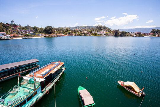 Lake Toba is a large natural lake in North Sumatra, Indonesia, located in the caldera of Mount Supervolcano. View from Parapat. This lake has a length of 100 kilometers, a width of 30 kilometers. 
