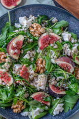 healthy barley salad with fresh figs, feta cheese and walnuts