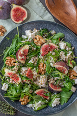 healthy barley salad with fresh figs, feta cheese and walnuts