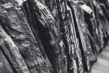 Fototapeta na wymiar slate rock nature stone closeup layer high detail black and white tone