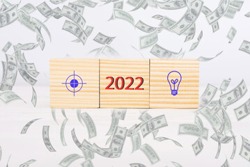 Business goal and idea 2022. wooden cubes with action plan icon, goal. Business development, reaching the goal in the new 2022