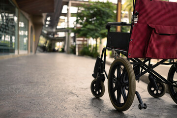 Obraz premium Empty wheelchair parked in hospital. Health care and insurance concept.