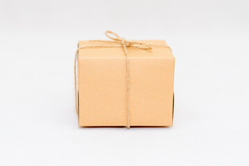 Holiday card. Beige gift box on white background. Flat lay,copy space.
