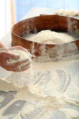 chef sifting flour for bread making