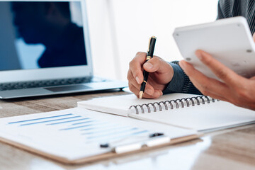 Close up view of bookkeeper or financial inspector hands making report, calculating or checking balance. Home finances, investment, economy, saving money or insurance concept.