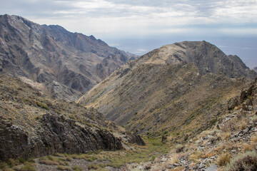 Beautiful Summer scenery: rocky mountains under the blue cloudy sky