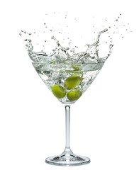 Martini glass with amazing splash from olive berries falling down in it. White background.