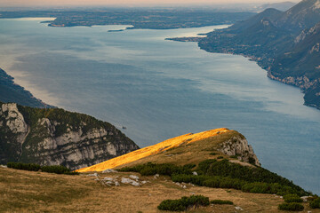 sunrise at lake garda from monte altissimo with view of south side of the lake in the morning, italy