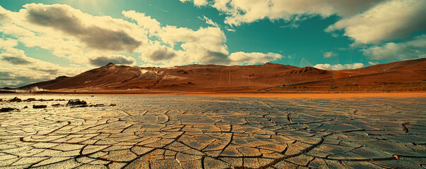 Fototapeta Cracked earth at the site of a dried  lake. Global climate change concept obraz