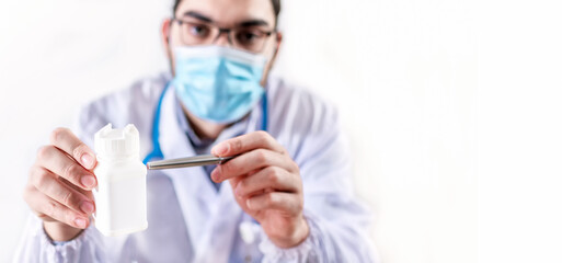 Doctor hold drug boxes at Office Desktop. Health care, Medical and Pharmacy Concept.