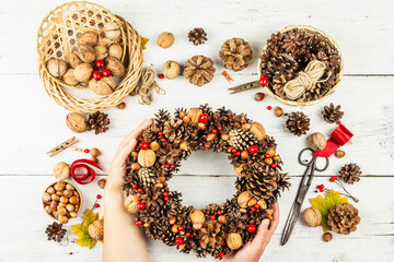 Autumn wreath of cones, nuts, and berries. Assortment from natural materials