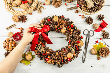 Autumn wreath of cones, nuts, and berries. Assortment from natural materials