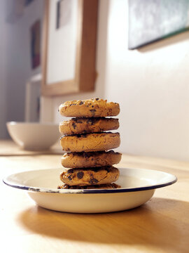 front view of homemade cookie tower on a white pewter plate on a table in the house