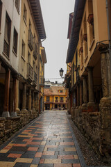 Fototapeta na wymiar Narrow street at medieval downtown in Aviles in the north of Spain