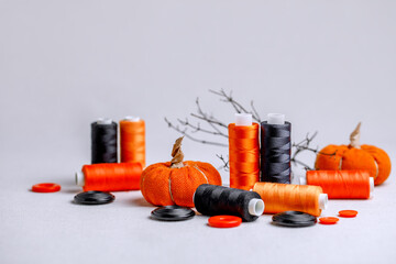 A set for creativity for Halloween in black and orange colors. Decorative threads and buttons on...