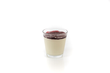 Fresh panna cotta in a glass isolated on a white background