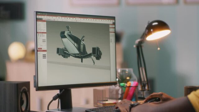 Black man browsing 3D model on computer