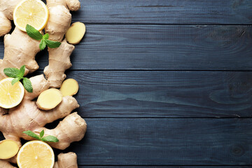 Ingredients for tea. Ginger root, lemon and mint on a wooden background.