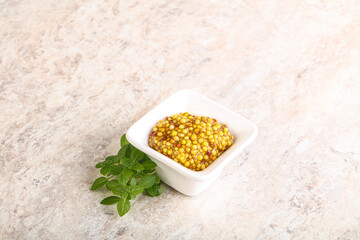Grain mustard sauce in the bowl