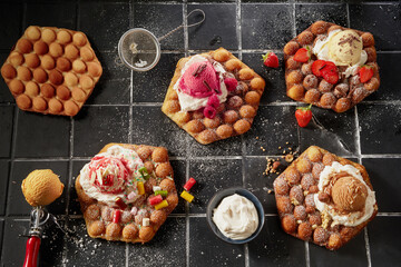Top down on an assortment of bubble waffles with ice-cream