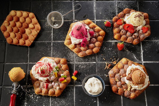 Top down on an assortment of bubble waffles with ice-cream