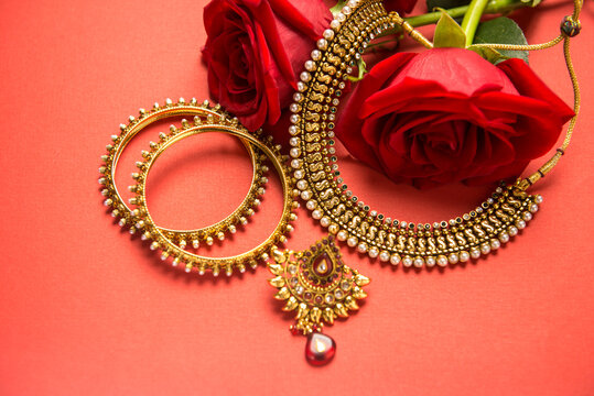 Beautiful Indian gold jewelry set with necklace and bangles. Close up jewelery and ornaments for Indian women or bride.