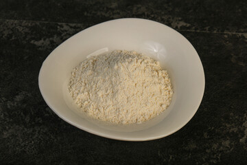 Wheat flour heap in the bowl