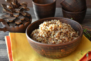 Buckwheat Porridge in rustic ceramic bowl on yellow napkin