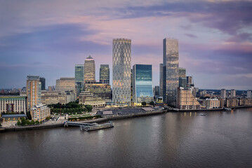 Fototapeta premium Aerial view of the skyline at the financial district of Canary Wharf in London, United Kingdom, during sunset time