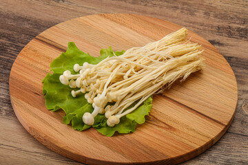 Raw Enoki mushrooms for cooking