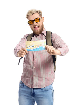 Male tourist with gift voucher on white background
