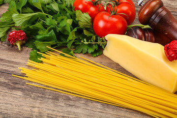 Raw Italian spaghetti heap with cheese
