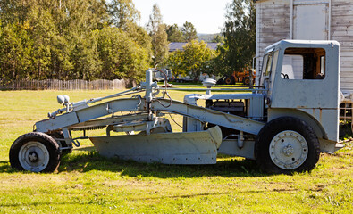 a very old and outdated snow plow