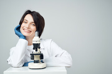 woman scientist laboratory microscope biotechnology research