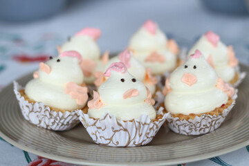 Happy Easter pink, yellow cupcakes with cute chickens. Spring cake