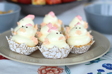 Happy Easter pink, yellow cupcakes with cute chickens. Spring cake