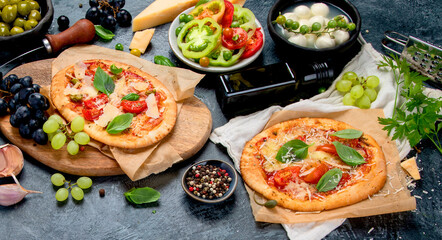 Italian food assortment on dark background.