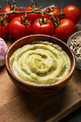 Bowl with tasty baba ghanoush on table, closeup