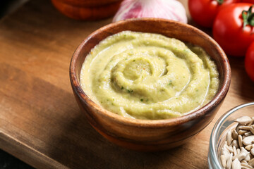 Bowl of traditional baba ghanoush on wooden table