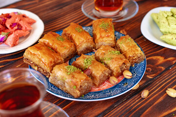 Turkish sweet baklava with Turkish tea on wooden background