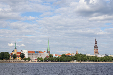 Fototapeta premium Cityscape view of old Riga architecture buildings and churches near river Daugava.
