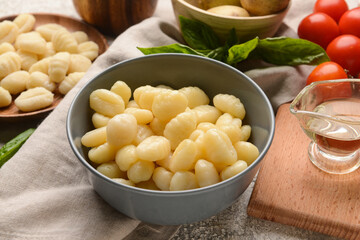 Bowl with tasty gnocchi on table