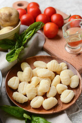 Plate with tasty gnocchi on table