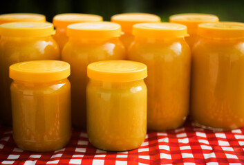 Jars of honey are presented on the table. Jars of honey are sold at the fair.
Ecologically natural product.