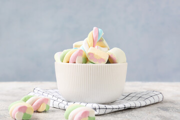 Bowl with tasty marshmallows on table