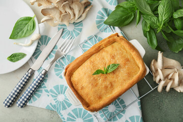 Baking dish with tasty mushroom pot pie on table